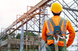 © visoot - Construction worker wearing safety harness and safety line working at high place,Practices of occupational safety and health can use hazard controls and interventions to mitigate workplace hazards.