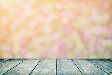 Wall Mural - Wood Table with Blurred Tropical Garden with Beautiful Bokeh Background, Suitable for Product Display and Natural Concept.