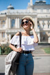 © F8  \ Suport Ukraine - Young beautiful woman with sunglasses walking the streets