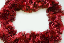 New Year's Christmas Red White Gold Tinsel On A White Background In The Center