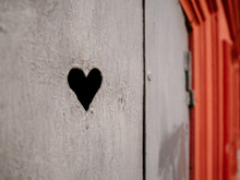 A Heart Carved Into A Metal Door