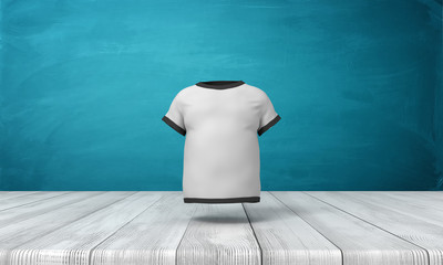 Wall Mural - 3d rendering of white men's T-shirt with black edge piping, suspended in air above wooden floor, near blue wall.