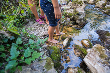Children Adventure At Forest Creek In Nature