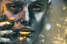Gold Paint Smudges Drips From Woman Face, Lips And Hand, Lipgloss   Dripping From Sexy Lips, Golden Liquid Drops On Beautiful Model Girl's   Mouth, Gold Metallic Skin Make-up. Beauty Woman Makeup Clos