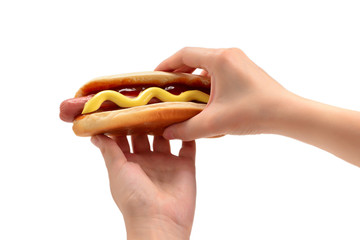 Wall Mural - Hot dog in woman hand isolated on white background. Copy space.