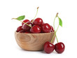 Wooden bowl of delicious ripe sweet cherries on white background