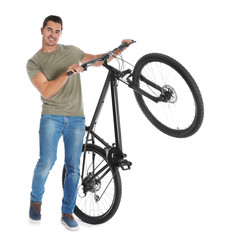 Canvas Print - Handsome young man with modern bicycle on white background