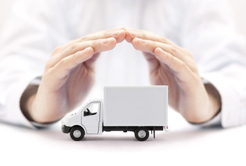 Poster - Cargo delivery truck protected by hands 