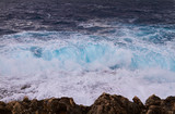 Fototapeta Natura - Huge waves crash on cloudy day. Kemmuna island