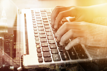 Close-up of typing female hands on keyboard. Double Exposure Concept