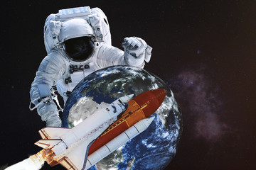 Wall Mural - astronaut in a front of earth planet of solar system with flying shuttle. science fiction. elements 