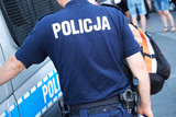 Fototapeta  - Katowice, Poland-august/15/2019 The policeman on the street on duty. Close up of police logo.