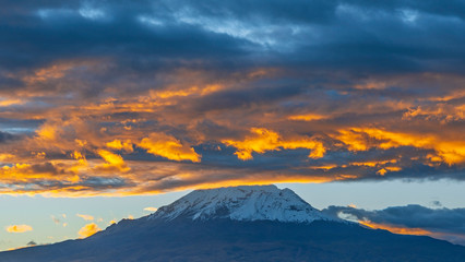 Wall Mural - The Chimborazo volcano and Andes mountain peak at sunset is the highest peak of Ecuador located near Riobamba city, South America.