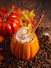 A Pumpkin Spice Latte On A Rustic Wooden Table