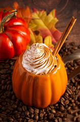 Wall Mural - A Pumpkin Spice Latte on a Rustic Wooden Table