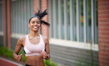 Stunning Young Black Woman, Fitness Model, Works Out On Outdoor Track - Jogging
