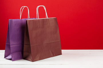  Several shopping bags with copy space on red background