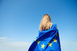 © gpointstudio - Rear view of young woman covered with European Union Flag