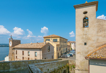 Wall Mural - Capodimonte (Italy) - A little old town on Bolsena lake with fortress and suggestive beach and water front; province of Viterbo, Lazio region