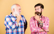 © be free - time to think. two bearded men senior and mature. youth vs old age compare. retirement. father and son family. generation conflict. barbershop and hairdresser. male beard care. checkered fashion