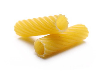 Pasta tubes, tortiglioni or elicoidali isolated on white background