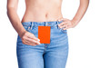 Woman holding red card at waist.