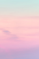 Vertical ratio size of sunset background. sky with soft and blur pastel colored clouds. gradient cloud on the beach resort. nature. sunrise.  peaceful morning. Instagram toned style