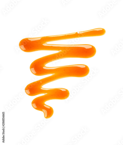 Caramel syrup drizzle isolated on white background Tableau sur Toile