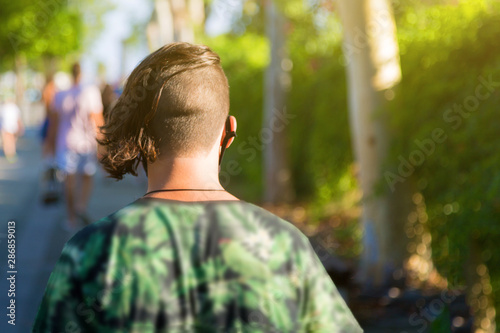 View From A Pin On A Man With A Short Haircut On His Head As He