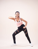 The young woman wearing exercise suit,doing dance workout,for exercise,with smile and happy feeling,