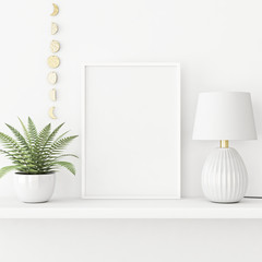 Interior poster mockup with vertical white frame standing on the table with plant in pot and lamp on empty wall background. 3D rendering, illustration.