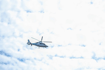 Wall Mural - St. Petersburg, Russia - August, 14, 2019: helicopter flies in the sky over St. Petersburg