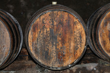 Rows Of Oak Wood Wine Barrels In Winery Cellar