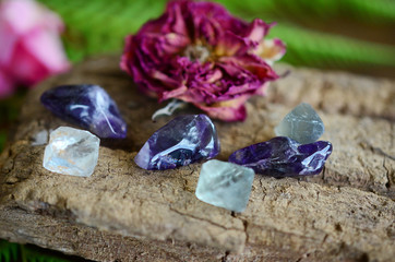 Wall Mural - Tumbled Amethyst & Mini Fluorite Octahedron - Miniature Healing Crystal bundle, great witchy gift, magick crystals. Crystals on wood desk, healing stone mock up with copy space and low exposure. 