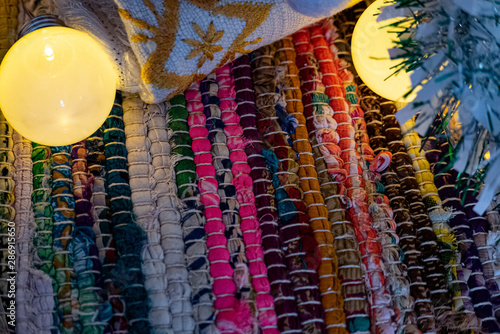 Chrismas garland lights over color carpet.