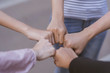 © Joke Phatrapong - Group of diversity people volunteer do gestures fist bump together circle after meeting deal successful. startup, friendship, unity and cooperation Concept