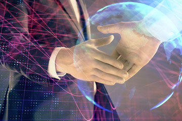 Multi exposure of world map on abstract background with two businessmen handshake. Concept of international business