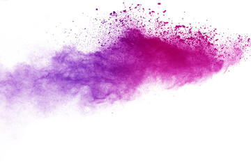 Wall Mural - Freeze motion of purple color powder exploding on white background.