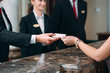 © davit85 - Picture of guests getting key card in hotel.