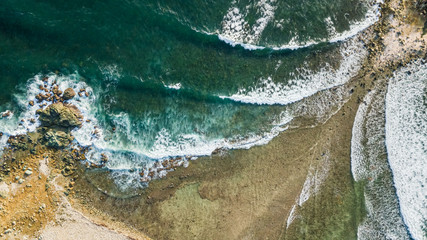 Canvas Print - Drone view of the seashore with waves hitting at Caye Chateau island in Saint Martin Sint Maarten