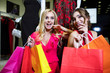 © proimagecontent - Surprise photo of satisfied charming shopping girlfriends