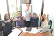 Young creative employees posing on camera in conference room. Company colleagues ready for open brainstorming session, group of multi ethnic business workers smiling at camera, multiple ethnic group