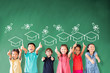 © Tom Wang - happy Multi-ethnic group of school children standing in classroom with graduation concept