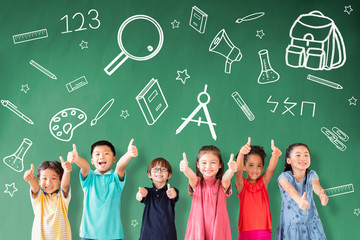 Wall Mural - happy Multi-ethnic group of school children standing in classroom with education concept