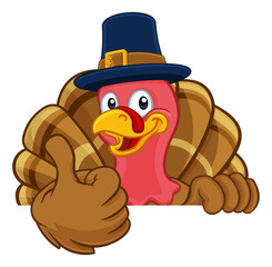 Poster - Pilgrim Turkey Thanksgiving bird animal cartoon character wearing a pilgrims hat. Peeking over a background sign and giving a thumbs up