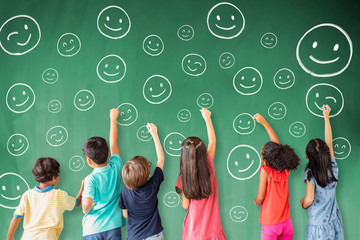 Wall Mural - school children drawing emotion face icon on the chalkboard