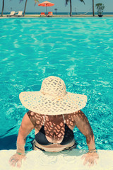 Poster - Beautiful woman at the swimming  pool