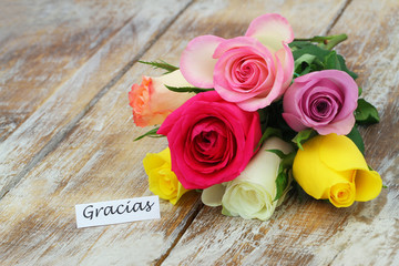 Poster - Gracias (thank you in Spanish) card with colorful rose bouquet on rustic wood