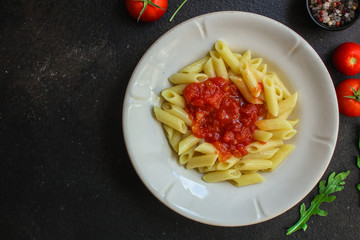 pasta penne and tomato sauce - delicious second course, menu concept. food background. copy space