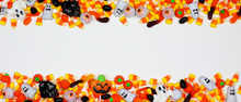 Halloween Candy Double Border Banner. Top View On A White Background With Copy Space.